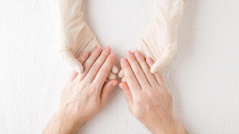 In this touching image, a doctor compassionately holds the hands of a patient, celebrating the successful treatment of a fungal nail infection using the Candela laser. The patient's nails, once discolored and misshapen, now appear healthy and restored. This photo captures a moment of relief and satisfaction shared between patient and doctor, highlighting the effectiveness of the Candela laser technology in treating challenging nail conditions